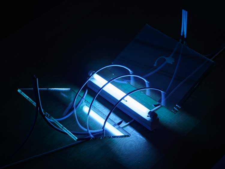 Hamad Butt, Transmission, 1990 (detail). Glass, steel, ultraviolet lights and electrical cables. Overall display dimensions variable. Exhibition view, Hamad Butt: Apprehensions, IMMA, 2024. Courtesy of the Irish Museum of Modern Art (IMMA). Photo: Ros Kavanagh.