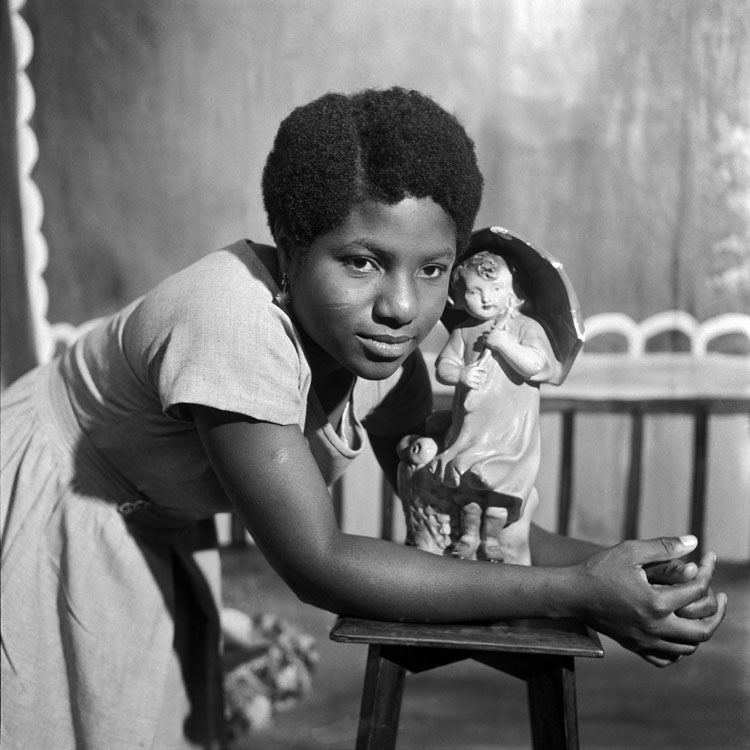 James Barnor. Beatrice with trademark figurine, Ever Young Studio, Accra, c1953. Courtesy of Autograph.