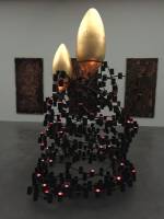 Michael Buthe. Holy Night of Virginity, 1992. 14 copper panels and one candelabra crowned with golden ovoids, 400 cm, copper panels 260 x 120 cm each. Kolumba, Cologne, installation view, Kunstmuseum Luzern, 2015. 
Photograph: Haus der Kunst © VG Bild-Kunst, Bonn, 2016.