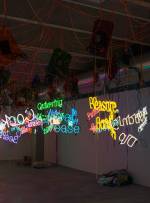 Jason Rhodes. Untitled (From the body of work: My Madinah: In pursuit of my ermitage...), 2004. 96 neon phrases, 96 coloured Plexiglas panels, 96 transformers, 96 metal hooks, wire, cable, rubber end caps, and power strips. Private collection, Moscow. Courtesy the Estate of Jason Rhoades, David Zwirner, New York and Hauser & Wirth.