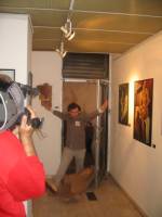 Dadadventure, September 9: Opening of the exhibition with &lsquo;Tristan Tzara&rsquo; breaking through the brown paper door in the exhibition &copy; Romanian Cultural Institute New York.