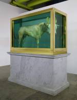 Damien Hirst. <em>The Golden Calf</em> (on plinth angle), 2008. Calf, 18 carat gold, glass, gold-plated steel, silicone and formaldehyde solution with Carrara marble plinth, 84.8 x 126 x 54 in. / 215.4 x 320 x 137.2 cm. &copy; Damien Hirst