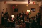 Jeff Wall, <em>A ventriloquist at a birthday party in October 1947</em>, 1990. Silver dye bleach transparency in light box 90 3/16 x 138 3/4 in. (229 x 352.5 cm). Emanuel Hoffmann-Stiftung, on permanent loan to the Oeffentliche Kunstsammlung Basel &copy; Jeff Wall 