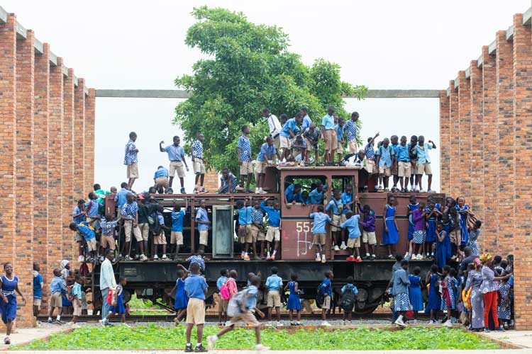 Visitors exploring the transported trains at Red Clay Studio, Tamale. © Ibrahim Mahama. Photo courtesy of the SCCA and Red Clay, Tamale.