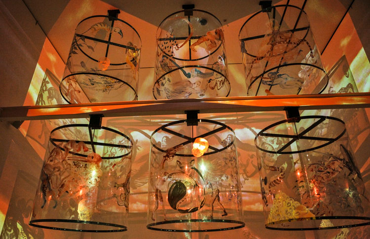 Nalini Malani, Gamepieces, 2003. Four channel video/shadow play, with six reverse painted Lexan cylinders, sound, 7 minutes. Installation view: Scenes from a New Heritage, MoMA, New York, 2015. Collection: MoMA, New York. Photo: Johan Pijnappel. © Nalini Malani