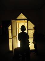 Mary Kelly and Ray Barrie. Love Songs, 2005&ndash;7. <em>Multi-Story House</em>, 2007. Wooden frame, cast acrylic panels, plate glass floor, fluorescent light, 244 x 183 x 244 cm. Courtesy Jose Carlos Teixeira and the artist. Collection of the artist.