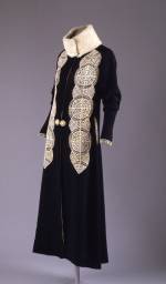 Paul Poiret (French, 1879&ndash;1944). Coat, ca. 1919. Black silk and wool rep weave with white kid cutwork appliqu&eacute; and white broadtail&nbsp;trim. The Metropolitan Museum of Art, Gift of Mrs. David J. Colton, 1961