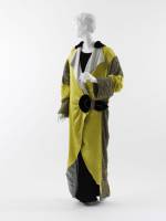 Paul Poiret (French, 1879&ndash;1944). Opera Coat, 1912. Yellow and pale blue silk satin, black silk velvet, turquoise silk satin with gold and silver fil&eacute; crocheted overlay, and silver fil&eacute; trapunto half-belt and trim. The Metropolitan Museum of Art, Purchase, Irene Lewisohn Bequest, 1982