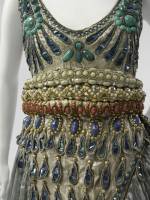 Paul Poiret (French, 1879-1944). Fancy Dress Costume, 1911. Seafoam green silk gauze, silver lam&eacute;, blue foil and blue and silver coiled cellophane cord appliqu&eacute;, and blue, silver, coral, pink, and turquoise cellulose beading. The Metropolitan Museum of Art, Purchase, Irene Lewisohn Bequest, 1983 
