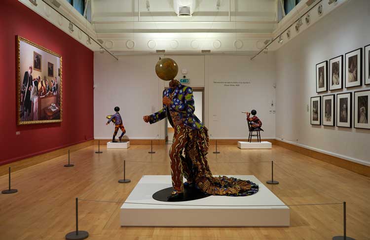 Yinka Shonibare RA. Earth, 2010. Fibreglass mannequin, Dutch wax-printed cotton textile, globe and metal, 180 x 190 x 190 cm. Wolverhampton Art Gallery.