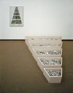 Robert Smithson. A Nonsite (Franklin, New Jersey), 1968. Painted wooden bins, limestone, gelatin-silver prints and typescript on paper with graphite and transfer letters, mounted on mat board. Bins installed: 16 ½ x 82 ¼ x 103 in. (41.9 x 208.9 x 261.6 cm). Framed: 40 ¾ x 30 ¾ x 1 in. (103.5 x 78.1 x 2.5 cm). Sheet: 39 7/8 x 29 7/8 in. (101.3 x 75.9 cm). Collection Museum of Contemporary Art Chicago, gift of Susan and Lewis Manilow  1979. Photograph: James Isberner, © Museum of Contemporary Art Chicago. Image courtesy James Cohan Gallery, New York/Shanghai.